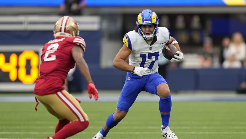 Los Angeles Rams wide receiver Puka Nacua, right, runs a pass as San Francisco 49ers cornerback Deommodore Lenoir defends during the first half of an NFL football game Sunday, Sept. 17, 2023, in Inglewood, Calif. 