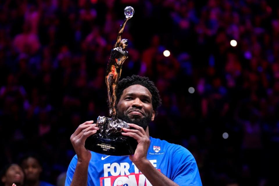 Philadelphia 76ers' Joel Embiid holds up the NBA Most Valuable Player trophy ahead of Game 3 in an NBA basketball Eastern Conference semifinals playoff series against the Boston Celtics, Friday, May 5, 2023, in Philadelphia. (AP Photo/Matt Slocum)