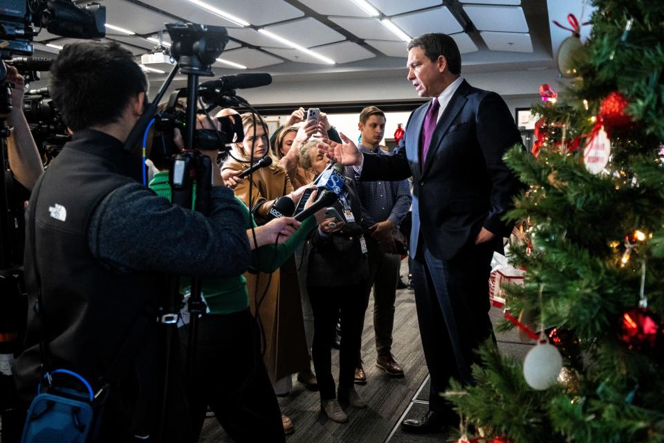 Republican presidential candidate Ron DeSantis speaks with reporters during a campaign stop at Elevate Business and Events Center on Friday, Dec. 8, 2023, in West Des Moines.