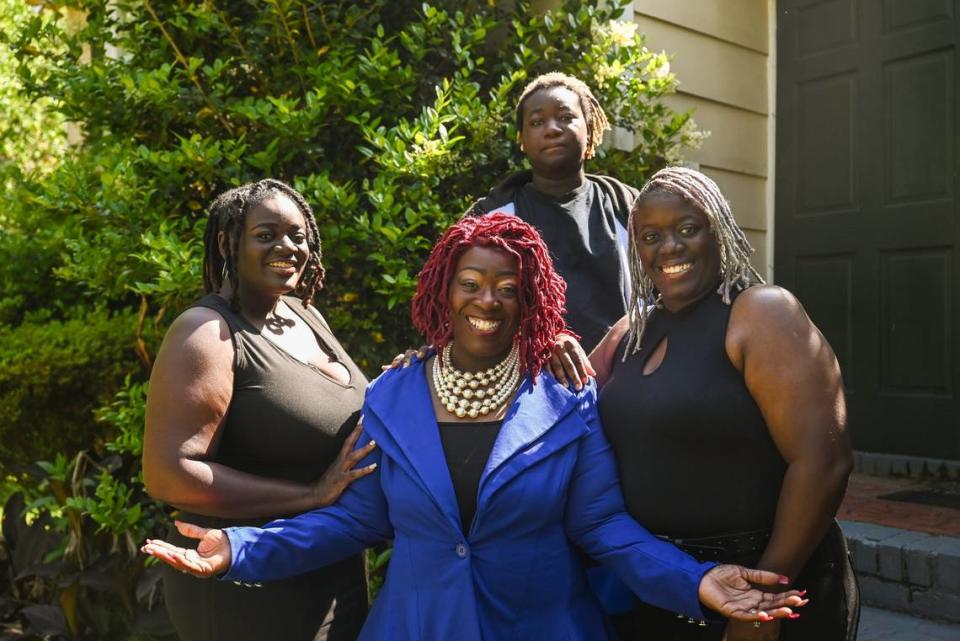 Karen McGirt, center, has six kids in her blended family, three of which are (from left) Khadejah Cloud, Imari Cunningham and Vanessa Cloud. She’s married now but remembers the challenge of trying to get an education as a single mom. “There was no sitter for me to attend school at night,” she says. “My income was low and I was barely making it. I wanted better for my children and myself.”