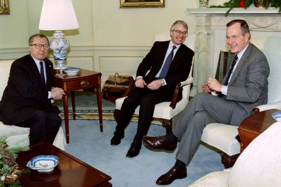 Mr Delors with then prime minister John Major and US president George HW Bush in 1992 (Getty)