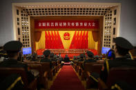 Members of Chinese military band watch an event to honor some of those involved in China's fight against COVID-19 at the Great Hall of the People in Beijing, Tuesday, Sept. 8, 2020. Chinese leader Xi Jinping is praising China's role in battling the global coronavirus pandemic and expressing support for the U.N.'s World Health Organization, in a repudiation of U.S. criticism and a bid to rally domestic support for Communist Party leadership. (AP Photo/Mark Schiefelbein)