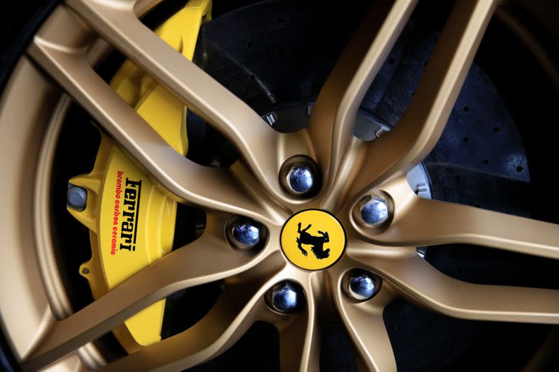 The Ferrari logo on the wheel of a car at a dealership in Singapore