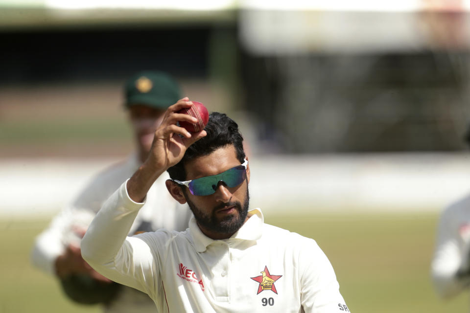 Zimbabwean player Sikandar Raza celebrates taking 7 wickets during the test cricket match against Sri Lanka at Harare Sports Club, in Harare, Wednesday, Jan. 29, 2020.(AP Photo/Tsvangirayi Mukwazhi)