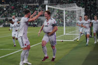 St Louis City FC Tim Parker (26) holds the ball under his jersey as he celebrates with teammates after his goal against the Austin FC during the first half of an MLS soccer match in Austin, Texas, Saturday, Feb. 25, 2023. (AP Photo/Eric Gay)