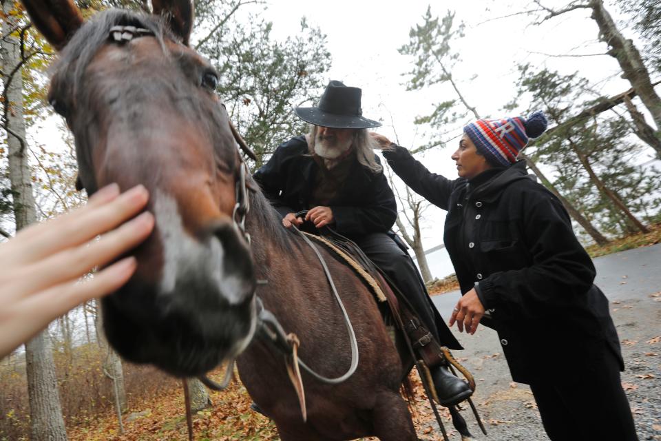 Lori Gomes fixes Mark Bracich's hair during filming of Sweet Freedom in Marion.