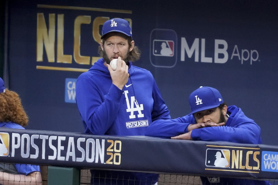 Los Angeles Dodgers starting pitcher Clayton Kershaw watches during the fourth inning in Game 2 of a baseball National League Championship Series against the Atlanta Braves Tuesday, Oct. 13, 2020, in Arlington, Texas. (AP Photo/Tony Gutierrez)
