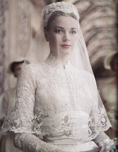 For her marriage to Prince Rainier of Monaco in 1956, Grace Kelly's ultra-feminine, demure lace gown was designed by Helen Rose, wardrobe designer at MGM.