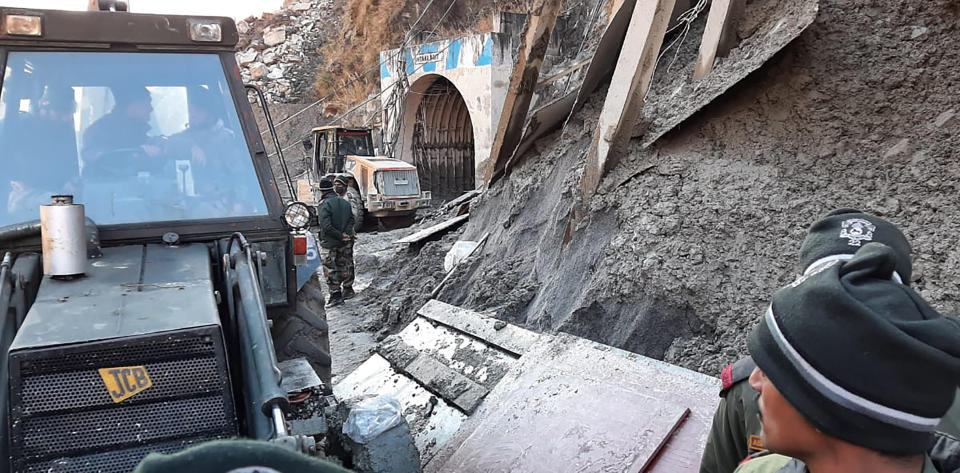 Indo Tibetan Border Police (ITBP) personnel undertake rescue work at one of the hydropower project at Reni village in ​​Chamoli district of Indian state of Uttrakhund, Monday, Feb.8, 2021. Rescue efforts continued on Monday to save 37 people after part of a glacier broke off, releasing a torrent of water and debris that slammed into two hydroelectric plants on Sunday. (AP Photo)