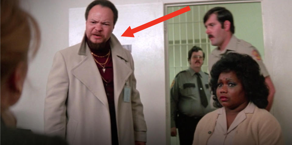 Stephen stands next to his on-screen wife in "Marie: A True Story," in the background are two cops and seen slightly out-of-frame to the left is the back of Sissy's head