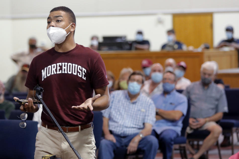 Tristian George, a resident of Clinton, La., who attends Morehouse College, speaks in favor of removing a Confederate soldier statue in front of the East Feliciana Parish courthouse, at a town hall meeting, in Clinton, La., on June 30, 2020. As protests sparked by the death of George Floyd in Minneapolis focus attention on the hundreds of Confederate statues still standing across the Southern landscape, officials in the rural parish of roughly 20,000 people recently voted to leave the statue where it is. (AP Photo/Gerald Herbert)