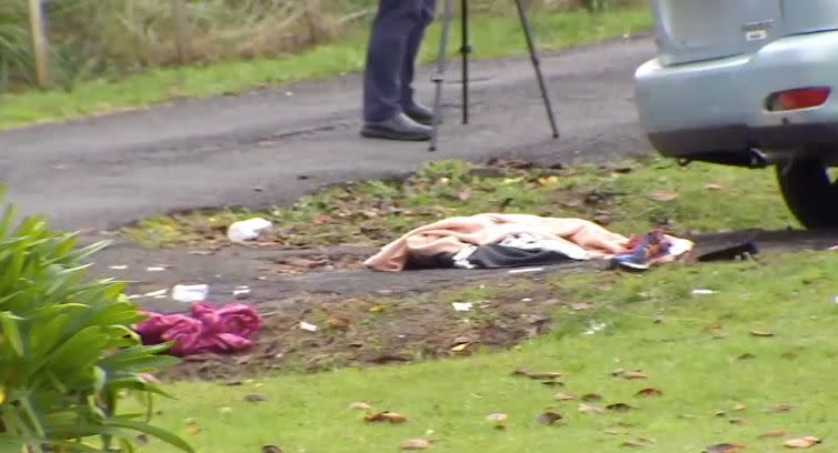 Several items lie on the ground near the property. Source: 1News