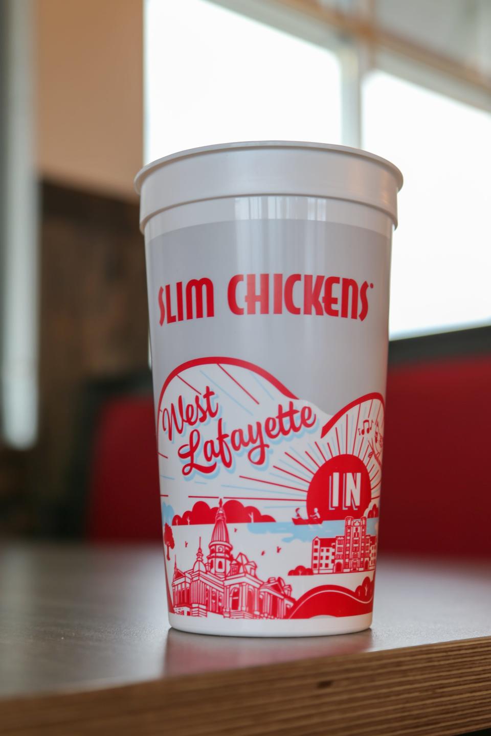 A commemorative cup Slim Chickens' first Indiana location, in West Lafayette at 2901 Northwestern Ave., near Purdue University, offers to its customers on its first day of operation, on Feb. 7, 2023, in West Lafayette, Ind.