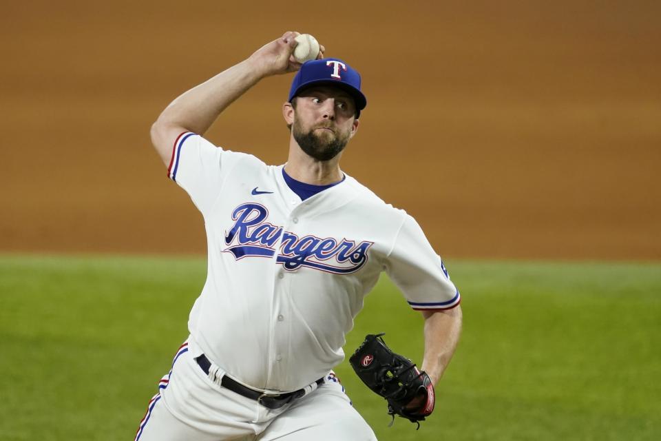 Texas Rangers starting pitcher Jordan Lyles throws during the fifth inning of the team's baseball game against the Houston Astros in Arlington, Texas, Tuesday, Sept. 14, 2021. (AP Photo/Tony Gutierrez)