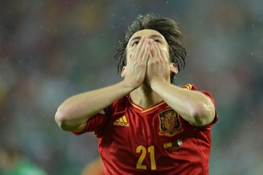 Spanish midfielder David Silva celebrates after scoring a goal during the Euro 2012 championships football match Spain vs Republic of Ireland at the Gdansk Arena. A double by Fernando Torres inspired defending champions Spain to a 4-0 thrashing of Ireland on Thursday in their Euro 2012 Group C match and ended Irish hopes of qualifying for the quarter-finals