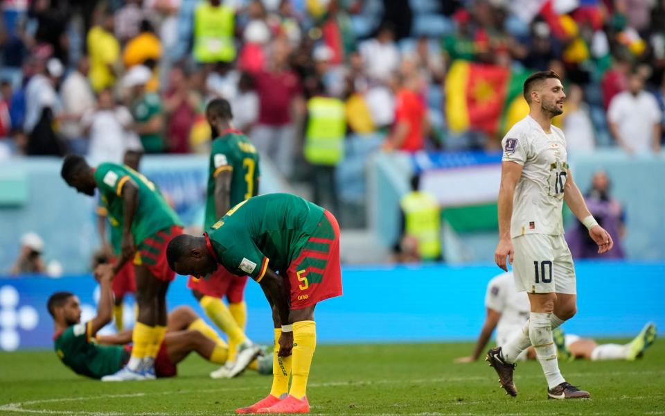 Serbia and Serbia players gesture at the end of the World Cup group G soccer matc - AP