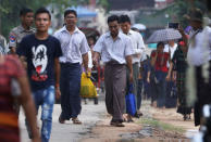 Reuters reporters Wa Lone and Kyaw Soe Oo walk free outside Insein prison after receiving a presidential pardon in Yangon, Myanmar, May 7, 2019. REUTERS/Ann Wang