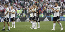 <p>German players walk to their supporters after losing the group F match (AP) </p>