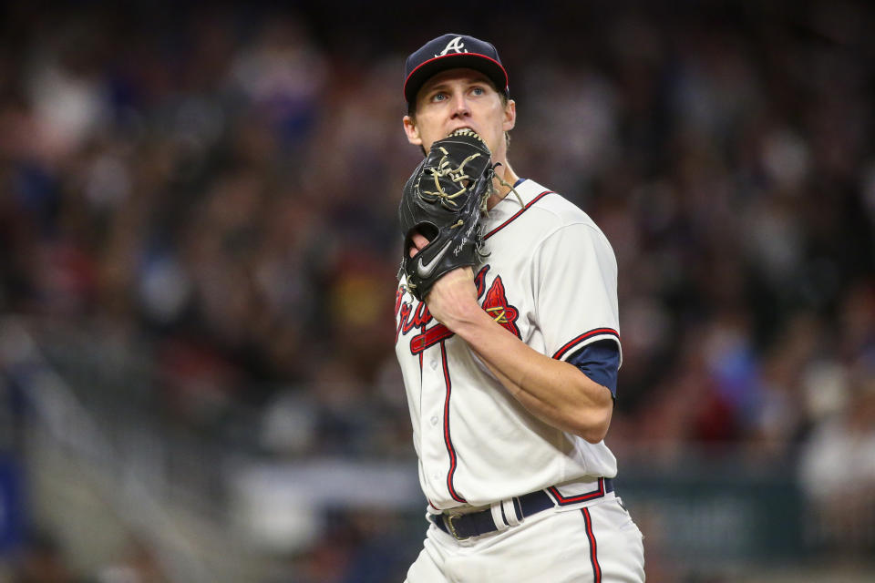 FILE - Atlanta Braves starting pitcher Kyle Wright (30) walks off the field in the fifth inning of a baseball game against the New York Mets, Saturday, Oct. 1, 2022, in Atlanta. The Braves have reason to hope that Wright, the majors' only 20-game winner last season, still has time to be ready for the regular season. If Wright requires more time to prepare for his first start, the Braves appear to be developing sufficient depth to fill their rotation. (AP Photo/Brett Davis, File)