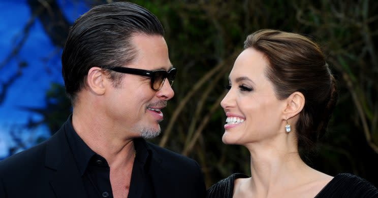 Happier times: Brad Pitt and Angelina Jolie attending an exhibition at Kensington Palace [Getty/Anthony Harvey/Stringer]