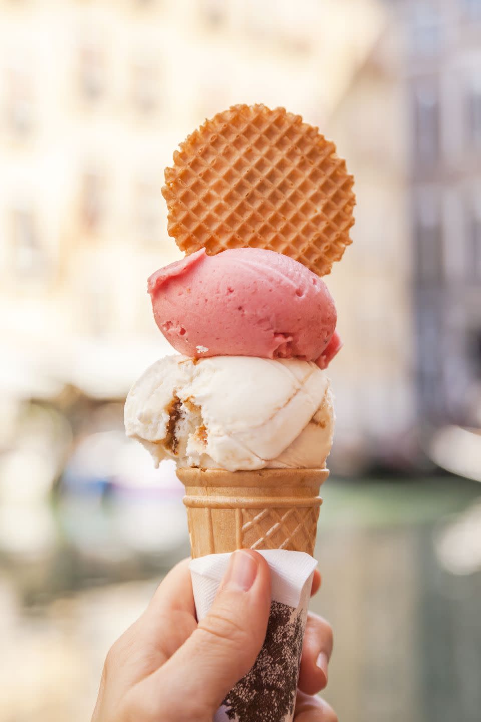 hand holding 'gelato' in venice