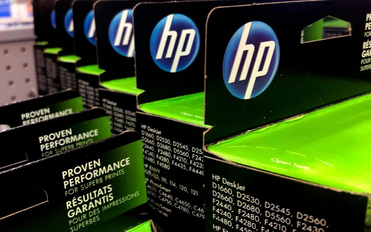 HP recently blocked customers from using cheaper, non-HP ink cartridges in its printers - Charles Krupa/AP