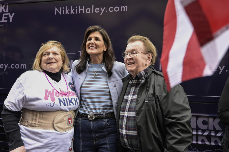 Republican presidential candidate former UN Ambassador Nikki Haley, center, poses for a photo with attendees at a campaign event in Newberry, S.C., Saturday, Feb. 10, 2024. (AP Photo/Matt Kelley)