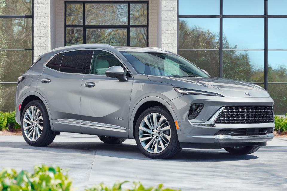 Front 3/4 view of the 2024 Buick Envision Avenir in Moonstone Gray Metallic.