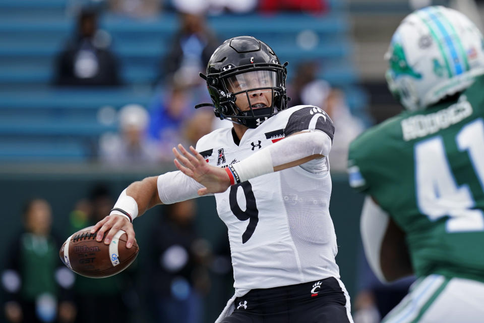 FILE - Cincinnati quarterback Desmond Ridder (9) passes during the first half of an NCAA college football game against Tulane in New Orleans, Saturday, Oct. 30, 2021. For Cincinnati (13-0), a member of the second-tier American Athletic Conference, the planets aligned. The Bearcats landed as the No. 4 seed in the CFP, invading the domain of college football's blue bloods. (AP Photo/Gerald Herbert, FIle)