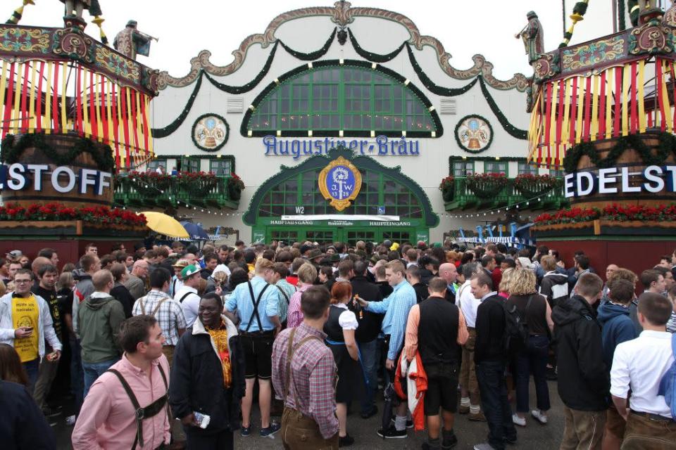 Visitors wait in front of a beer tent during the opening day of Oktoberfest 2012.