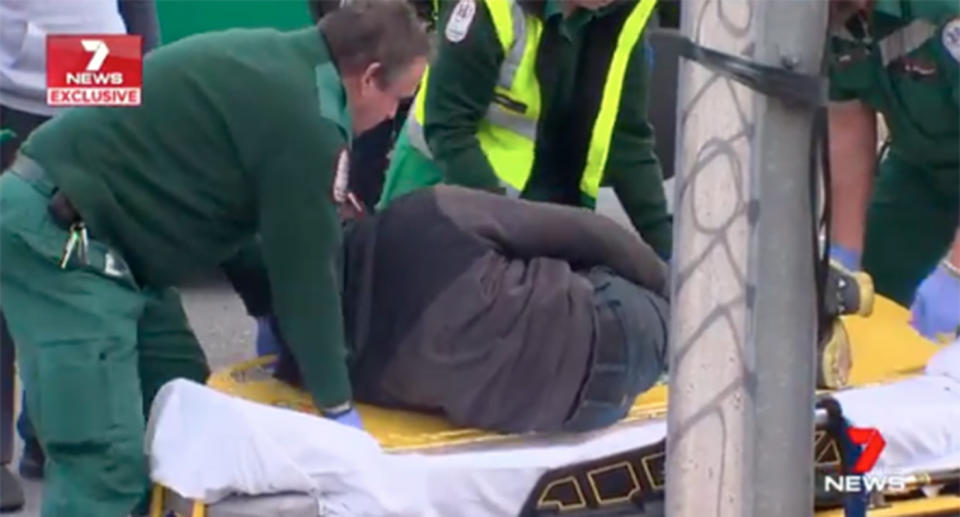 Adelaide paramedics were trying to treat an injured motorcyclist who had to be restrained when he turned on them. Source: 7 News