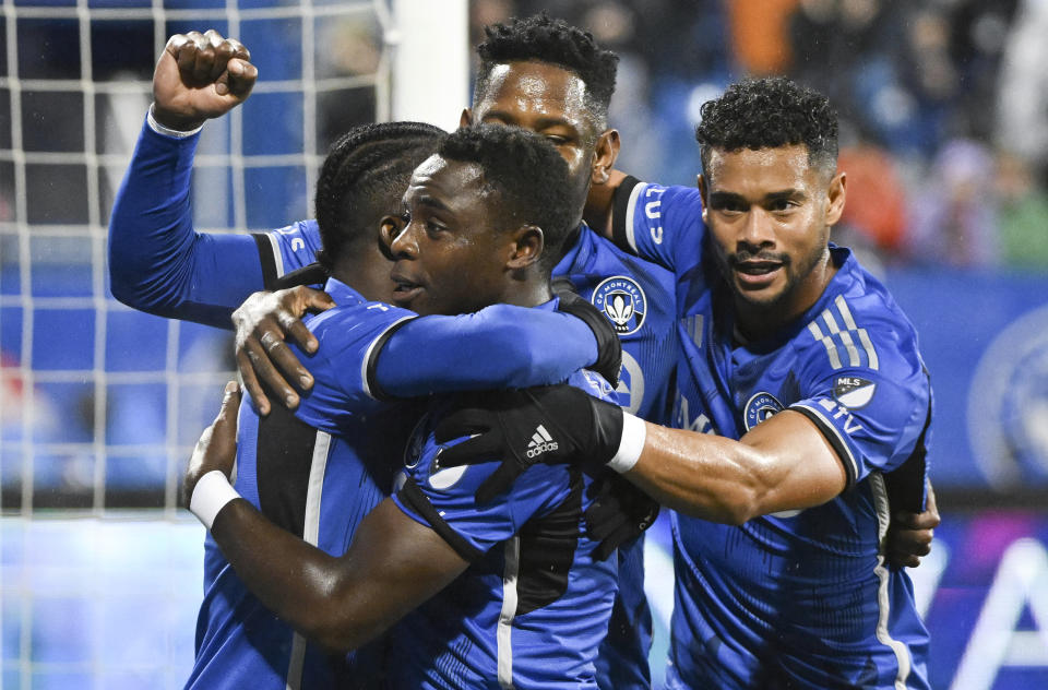 CF Montreal's Sunusi Ibrahim, second left, celebrates with teammates after scoring against the Portland Timbers during the first half of an MLS soccer game in Montreal, Saturday, Oct. 7, 2023. (Graham Hughes/The Canadian Press via AP)