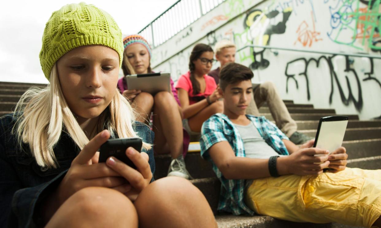 <span>Children browse the internet on mobile devices. Almost every leading tech firm was mentioned by those interviewed by Ofcom.</span><span>Photograph: Radius Images/Alamy</span>