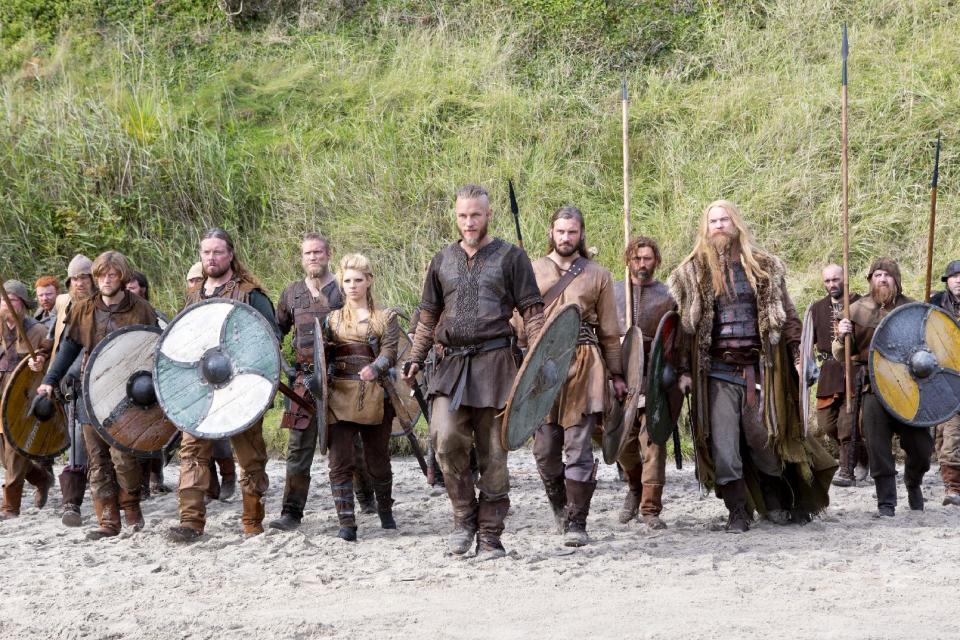 This image released by History shows Travis Fimmel as Ragnar, center, in a scene from "Vikings," premiering Sunday, March 3 on History. (AP Photo/History, Jonathan Hession)