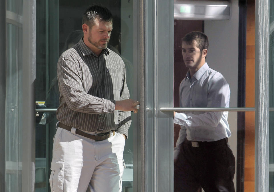 FILE - In this Oct. 22, 2013 file photo, Eric Jensen, 37, left, and Ryan Jensen, 33, leave the federal courthouse in Denver. On Tuesday, Jan. 28, 2014, the two Colorado cantaloupe farmers who pleaded guilty to charges stemming from a deadly listeria outbreak in 2011 are scheduled to be sentenced. The brothers, who owned and operated Jensen Farms in Holly, face up to six years in prison and $1.5 million in fines. The outbreak was traced to tainted fruit from the farm, causing 33 deaths and sending scores of people to hospitals. (AP Photo/Ed Andrieski, File)