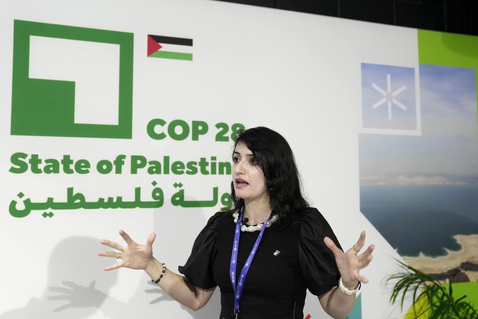 FILE - Hadeel Ikhmais, a climate change expert with the Palestinian Authority, speaks to The Associated Press at the COP28 U.N. Climate Summit, Friday, Dec. 1, 2023, in Dubai, United Arab Emirates. (AP Photo/Joshua A. Bickel, File)