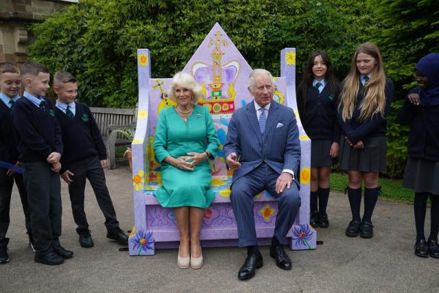 King Charles III and Queen Camilla meet pupils from Belfast&#x002019;s Blythefield Primary School who have taken part in Historic Royal Palaces&#x002019; competition to design Coronation benches at Hillsborough Castle, Co Down during a two day visit to Northern Ireland. Picture date: Wednesday May 24, 2023. (PA Wire)