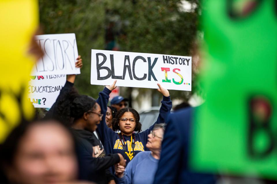 Hundreds participate in the National Action Network demonstration in response to Gov. Ron DeSantis' rejection of a high school African American history course on Feb. 15 in Tallahassee, Fla. In a statement on April 24, the College Board announced changes will be made to the new AP African American course framework amid criticism earlier in the year that the agency bowed to political pressure and removed several topics from the framework, including Black Lives Matter, slavery reparations and queer life.