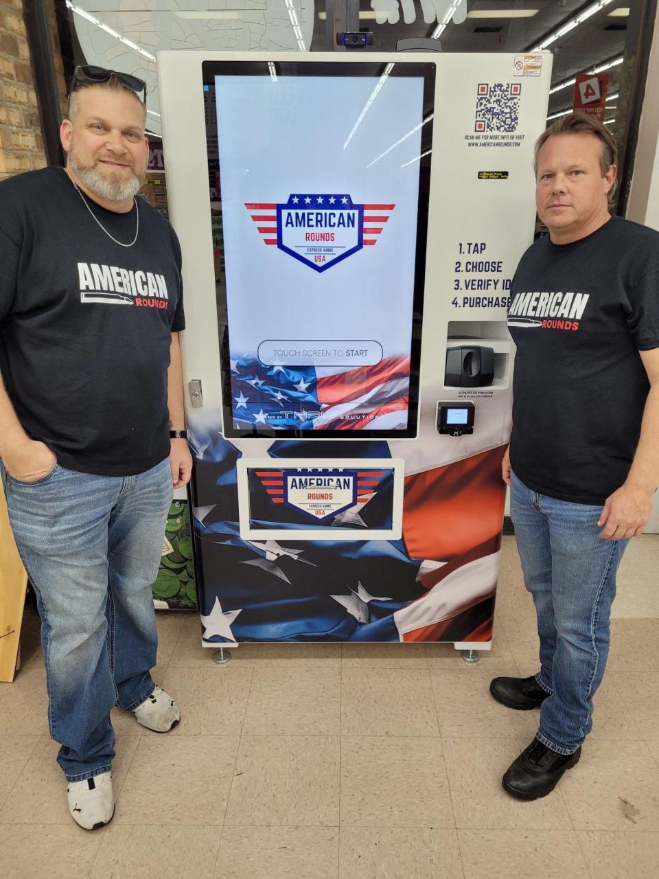 Lawrence Songer, left, and Grant Magers stand in front of a new ammunition dispensing machine from their company American Rounds. The machines have been installed in at least 8 stores in Texas, Oklahoma and Alabama since the company's founding in 2023.