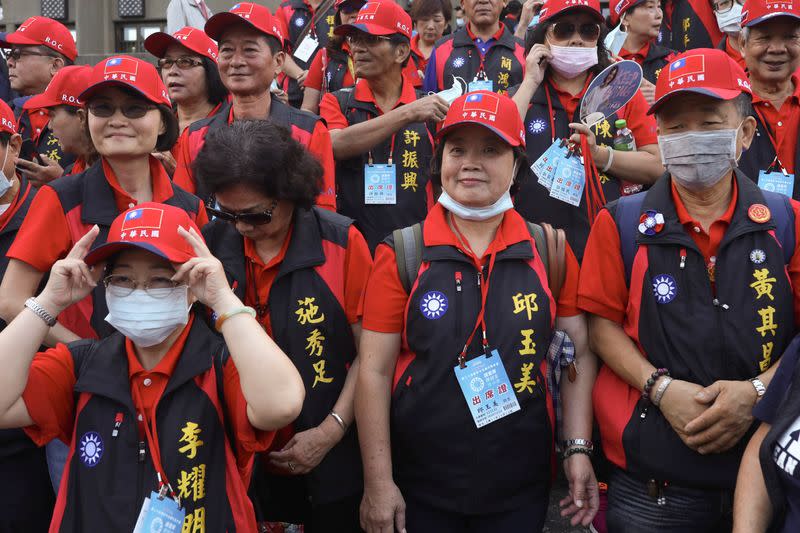 Members from the Kuomintang, Taiwan's main opposition, arrive to attend its annual conference in Taipei