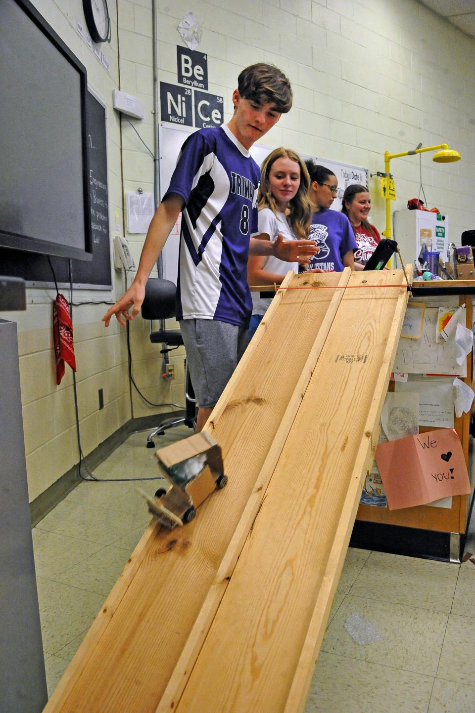 Bryce Meade sends his car down the ramp for a crash test.