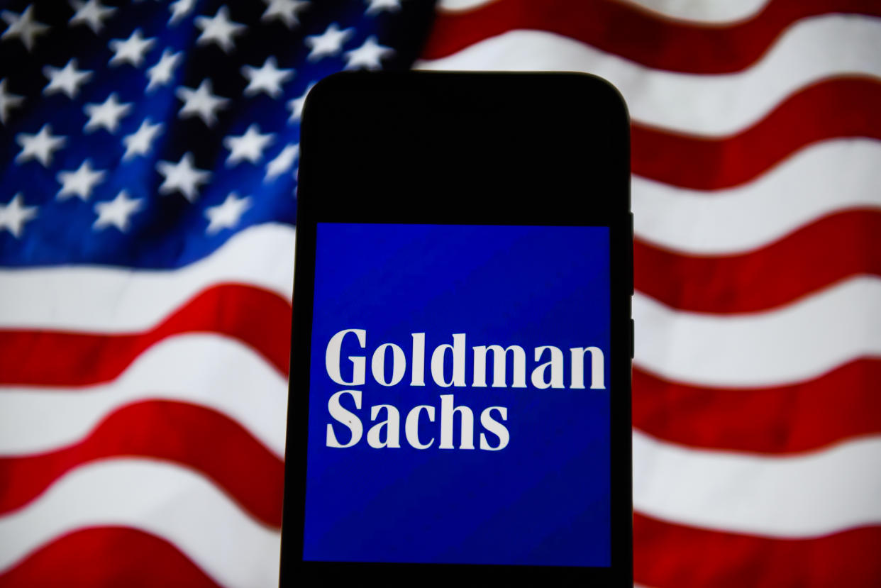 POLAND - 2020/02/23: In this photo illustration a Goldman Sachs seen displayed on a smartphone with the United States of America flag on the background. (Photo Illustration by Omar Marques/SOPA Images/LightRocket via Getty Images)