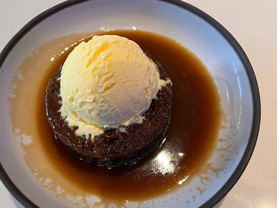 Sticky toffee pudding with vanilla ice cream on top