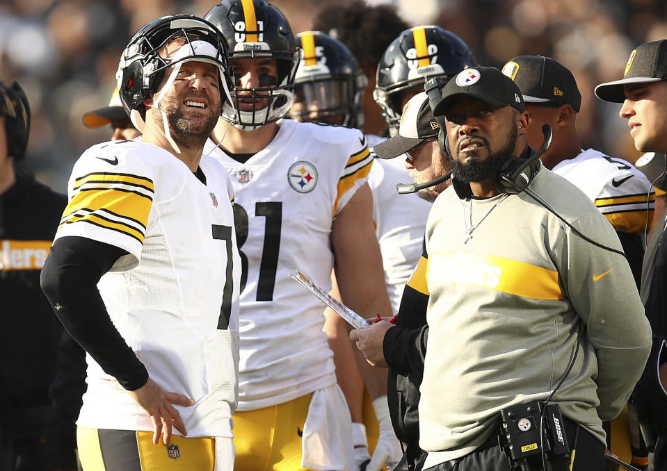 Pittsburgh Steelers quarterback Ben Roethlisberger, left, talks with head coach Mike Tomlin during the first half of an NFL football game against the Oakland Raiders in Oakland, Calif., Sunday, Dec. 9, 2018. (AP Photo/Ben Margot)