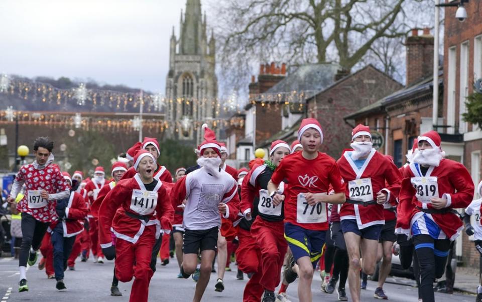 Runners take part in a Santa run in Marlow, Buckinghamshire (Steve Parsons/PA) (PA Wire)