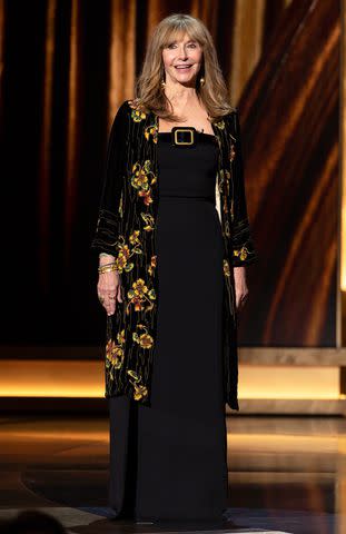 <p>Disney/Frank Micelotta</p> Mary Steenburgen wears black jacket with floral print while presenting award for Best Supporting Actress.