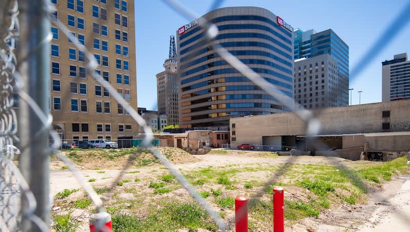 A fence blocks access to the lot where the Utah Pantages Theater once stood in downtown Salt Lake City on Thursday. The theater was torn down two years ago on Friday, but construction has yet to start a replacement.