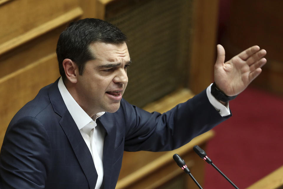 Greece's Prime Minister Alexis Tsipras delivers his speech during a parliament debate about Prespa Agreement in Athens, Thursday, Jan. 24, 2019. Greek lawmakers are debating a historic agreement aimed at normalizing relations with Macedonia in a stormy parliamentary session scheduled to culminate in a Friday vote. (AP Photo/Yorgos Karahalis)