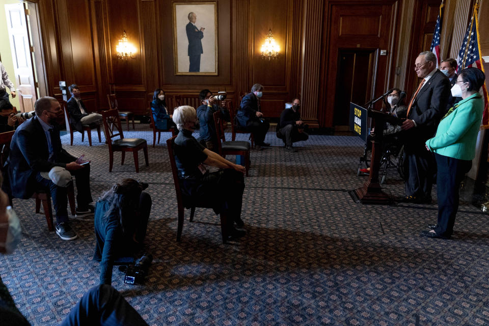 Senate Majority Leader Chuck Schumer of N.Y., accompanied by Sen. Mazie Hirono, D-Hawaii, right, Sen. Tammy Duckworth, D-Ill., fourth from right, and Sen. Richard Blumenthal, D-Conn., second from right, speaks at a news conference after the Senate passes a COVID-19 Hate Crimes Act on Capitol Hill, Thursday, April 22, 2021, in Washington. (AP Photo/Andrew Harnik)