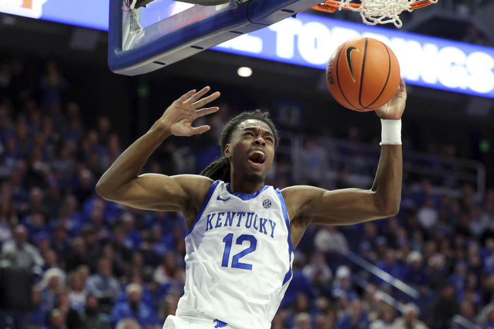 Kentucky's Antonio Reeves (12) reacts after his dunk during the first half of the team's NCAA college basketball game against Georgia, Saturday, Jan. 20, 2024, in Lexington, Ky. (AP Photo/James Crisp)